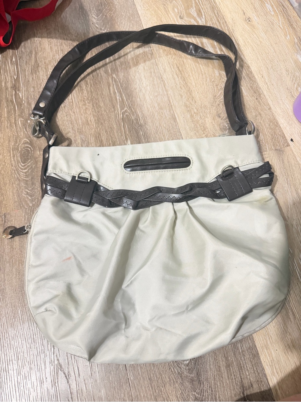 Stylish Cream Shoulder Bag with Dark Brown Trim travelon for flying